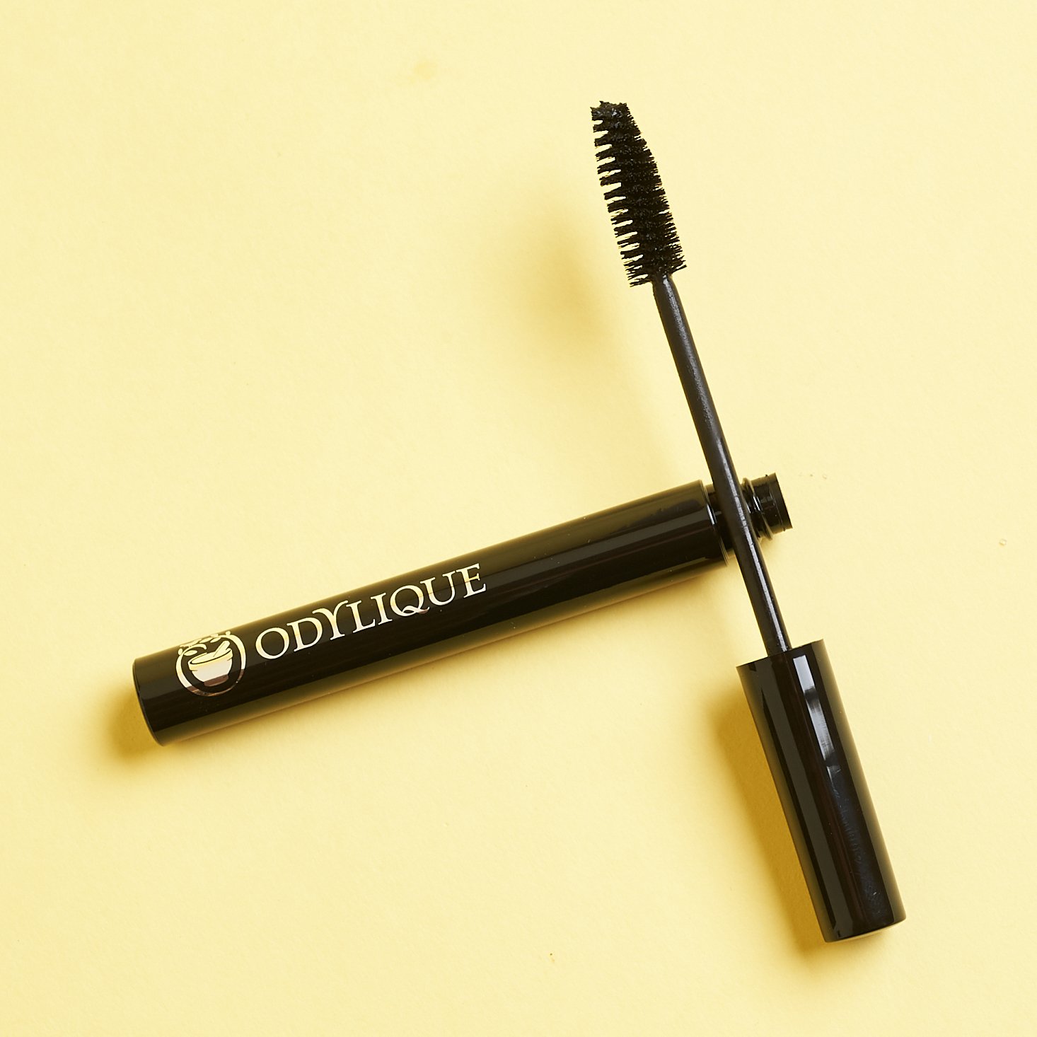 Odylique Mascara opened with wand leaning on tube