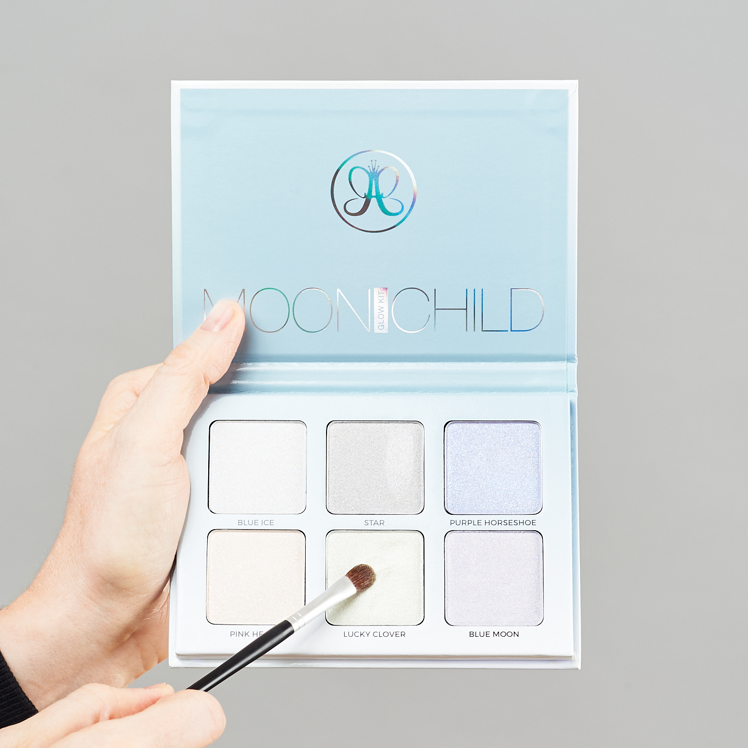 Moonchild Glow Kit from Anatasia Beverly Hills with brush pointing to Lucky Clover