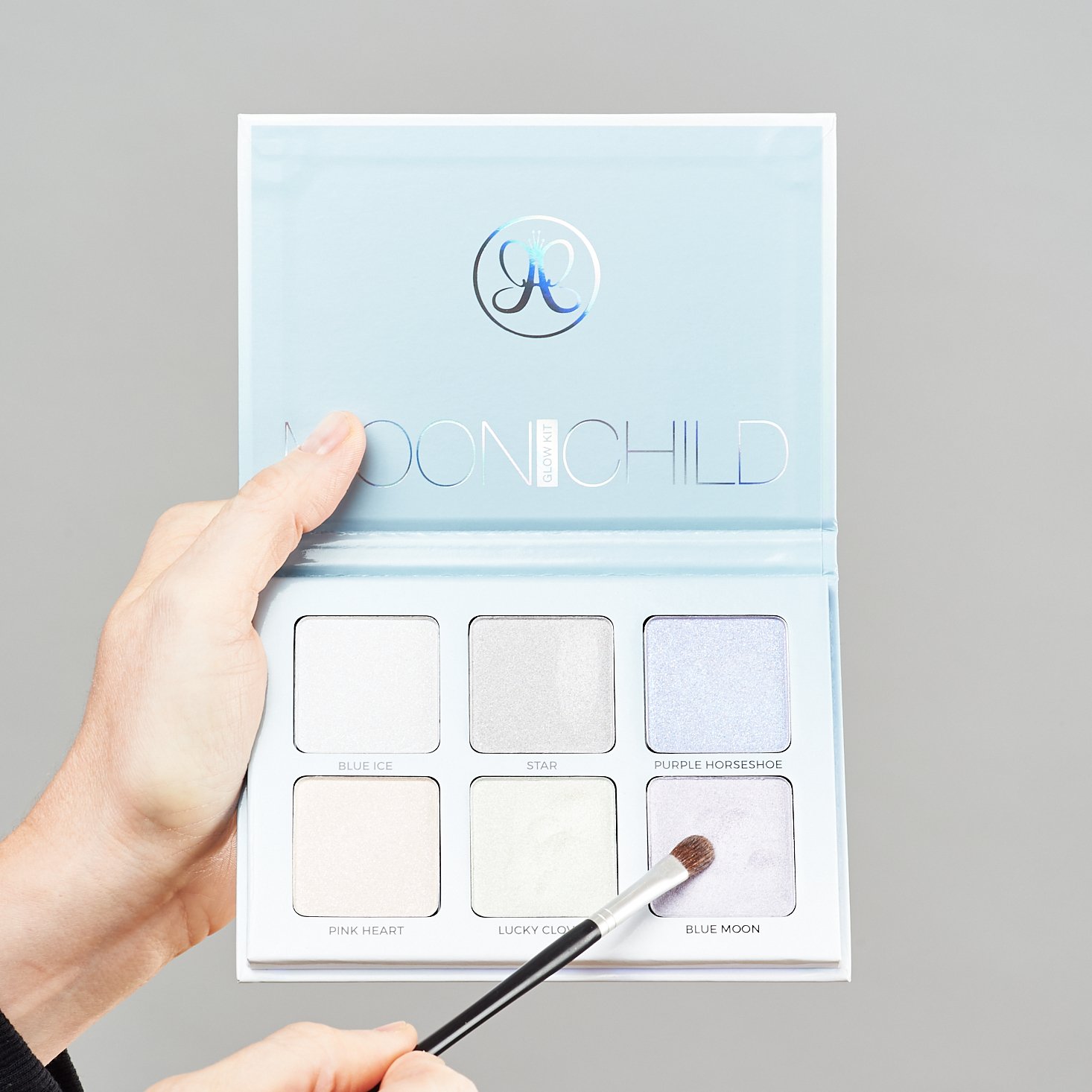 Moonchild Glow Kit from Anatasia Beverly Hills with brush pointing to Blue Moon