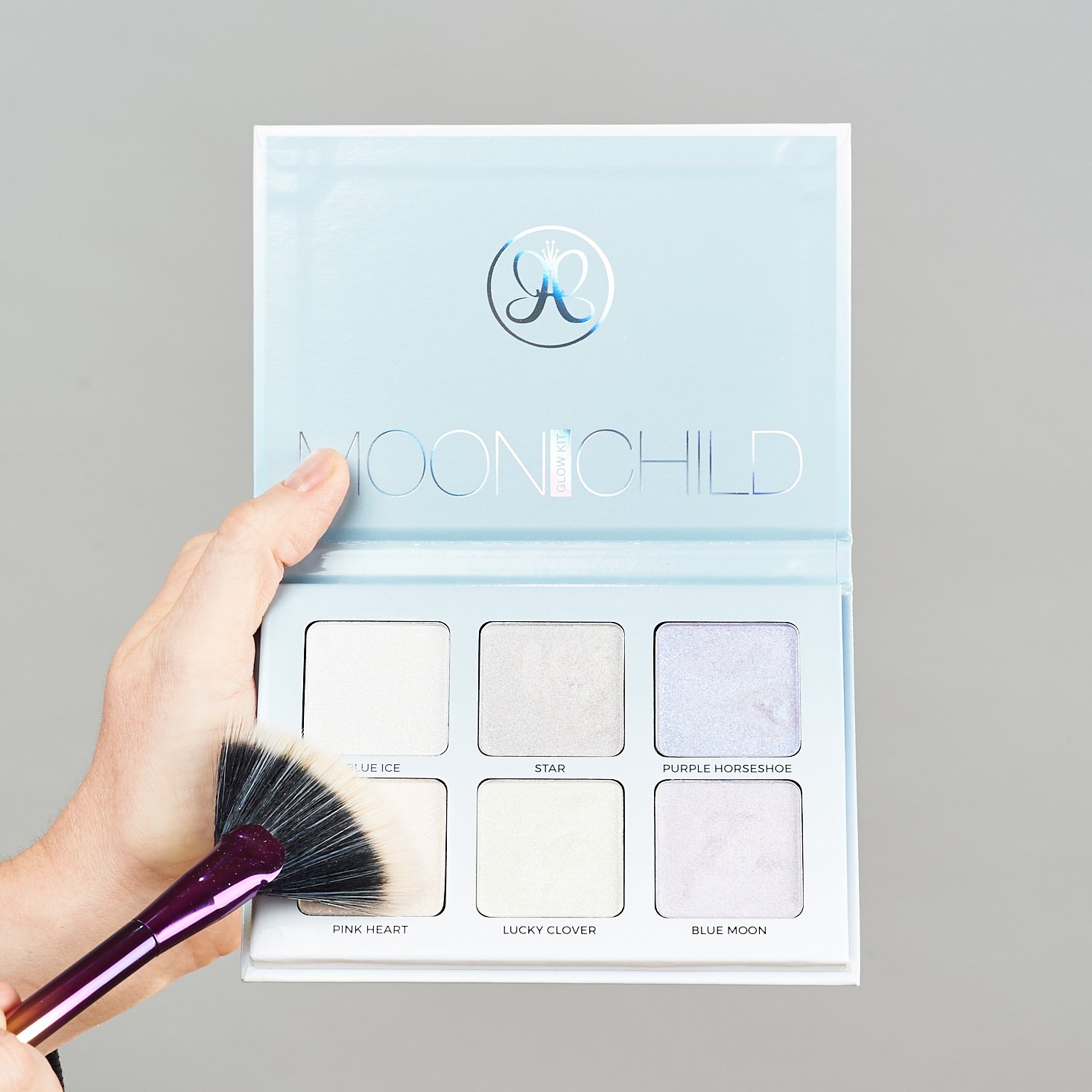 Moonchild Glow Kit from Anatasia Beverly Hills with brush pointing to Pink Heart
