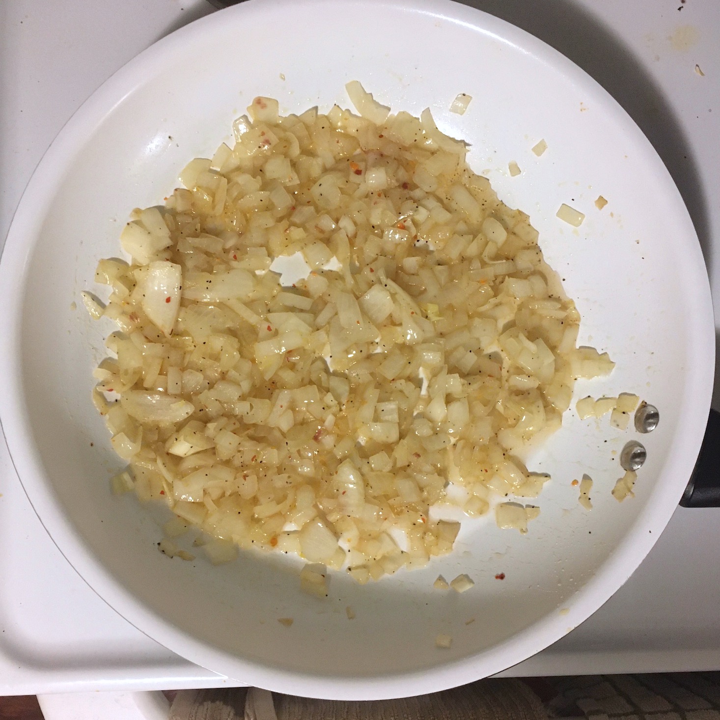 peruvian quinoa bowl onions in pan