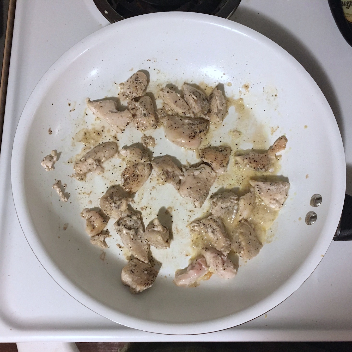 korean chicken cooking in pan