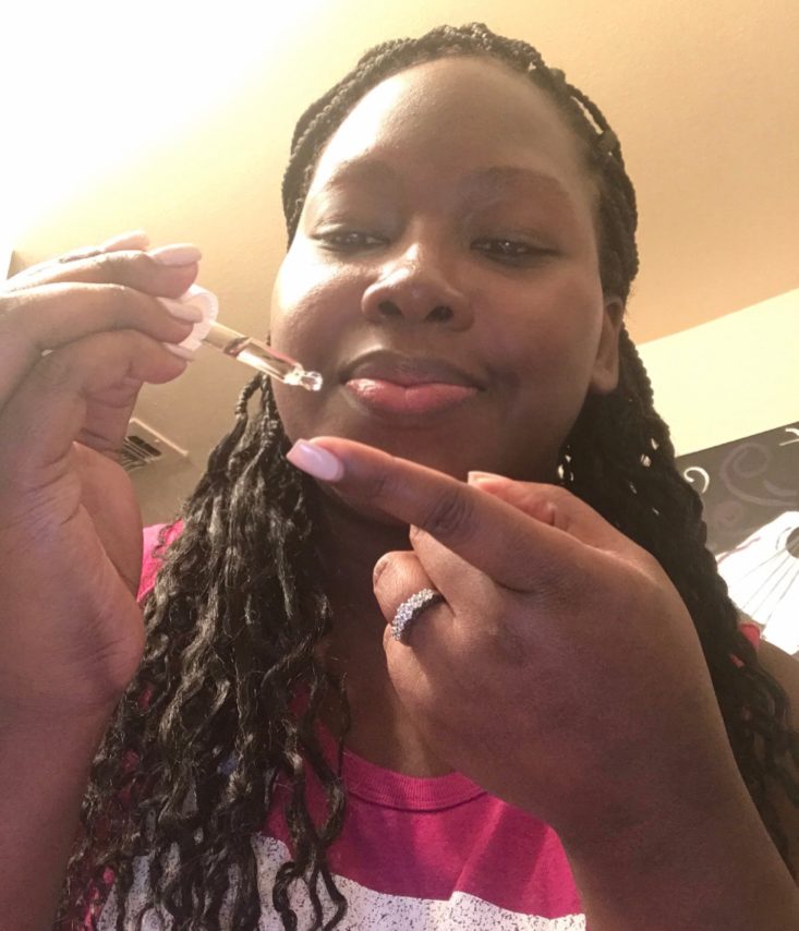 Boxycharm Tutorial December 2019 - Applying The Rose Oil on Finger With Dropper