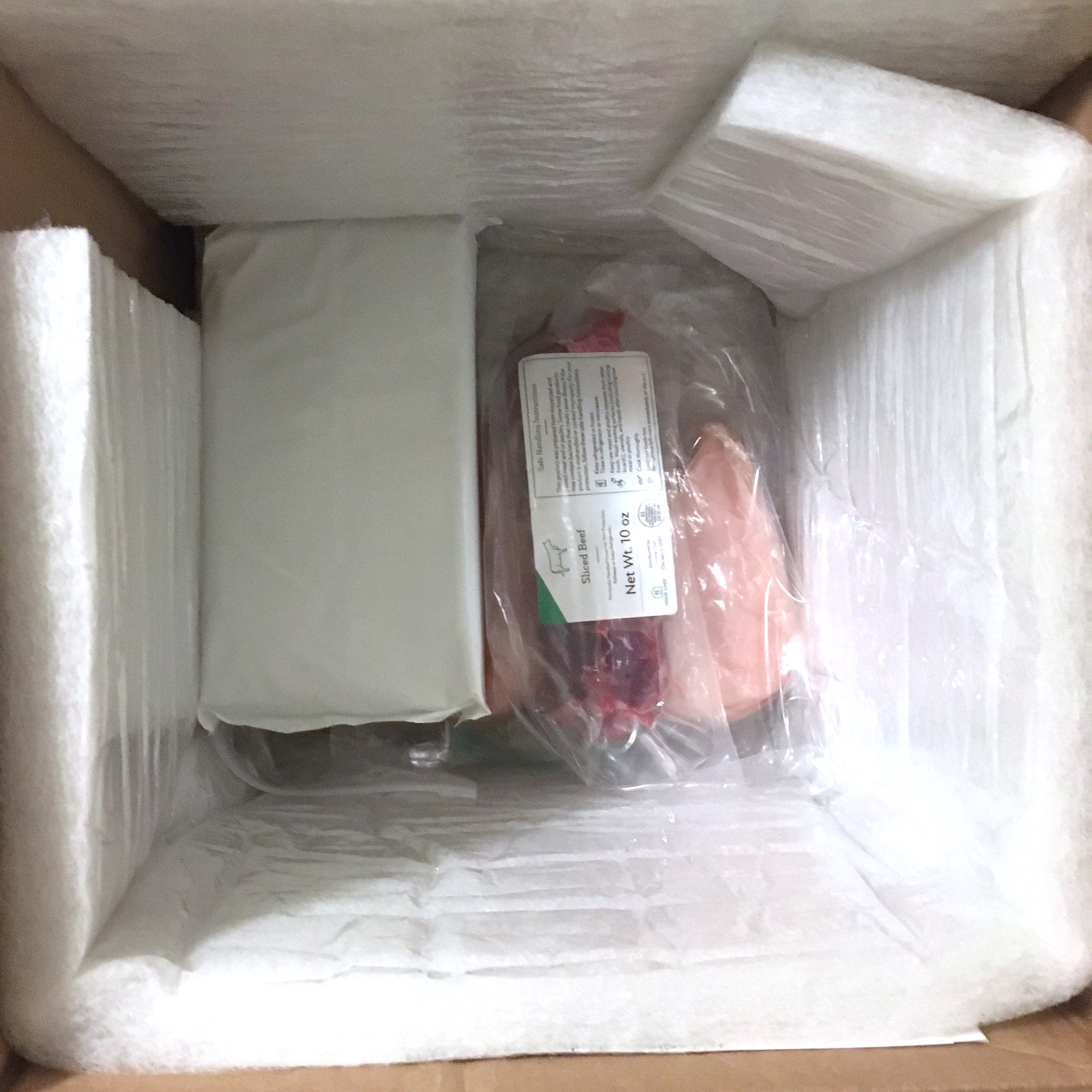 interior box view with protein and ice pack in bottom