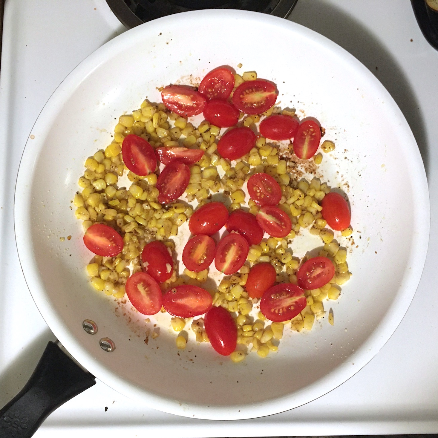 tomatoes and corn in pan