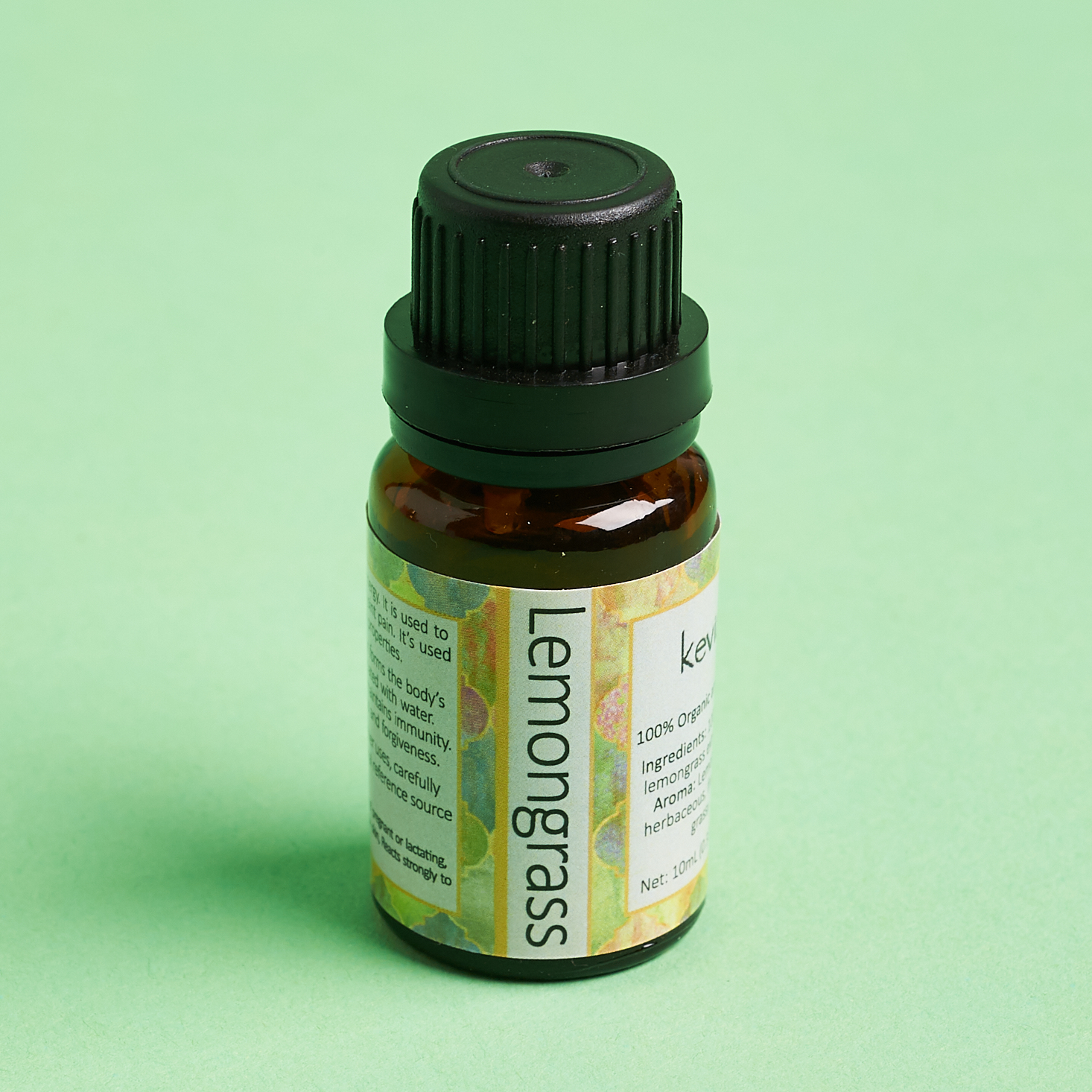 lemongrass essential oil in amber bottle with black cap