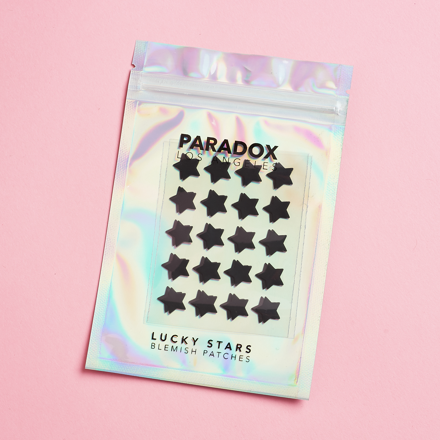 holographic pack with black pimple star stickers