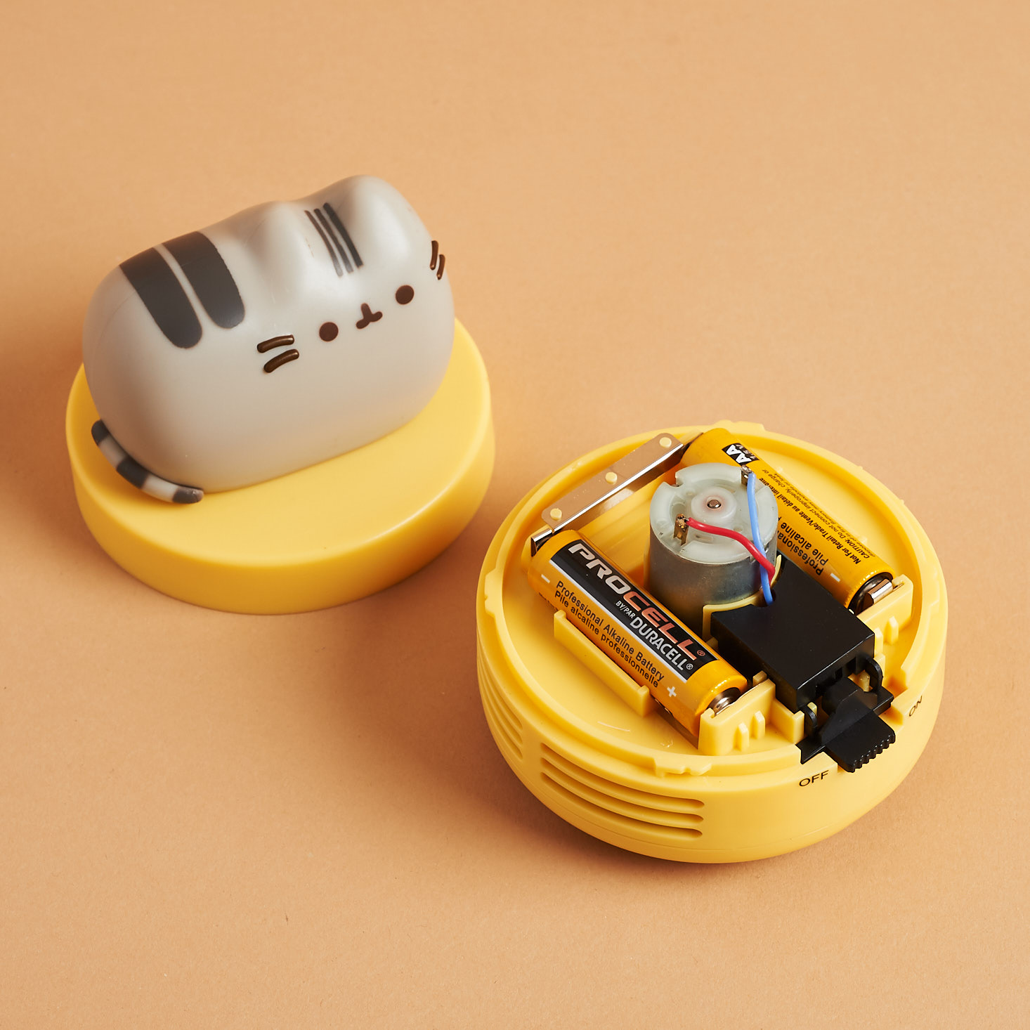 disassembled Mini Pusheen Vacuum to show where batteries go