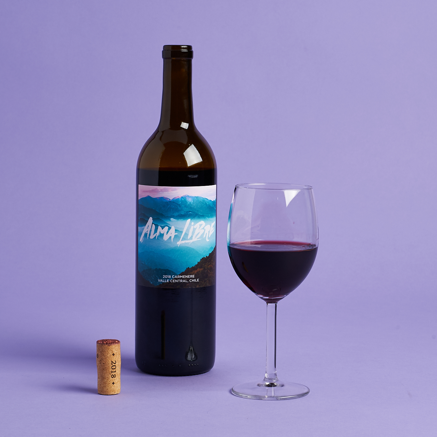 Alma Libre Carménère bottle with poured glass and upright cork