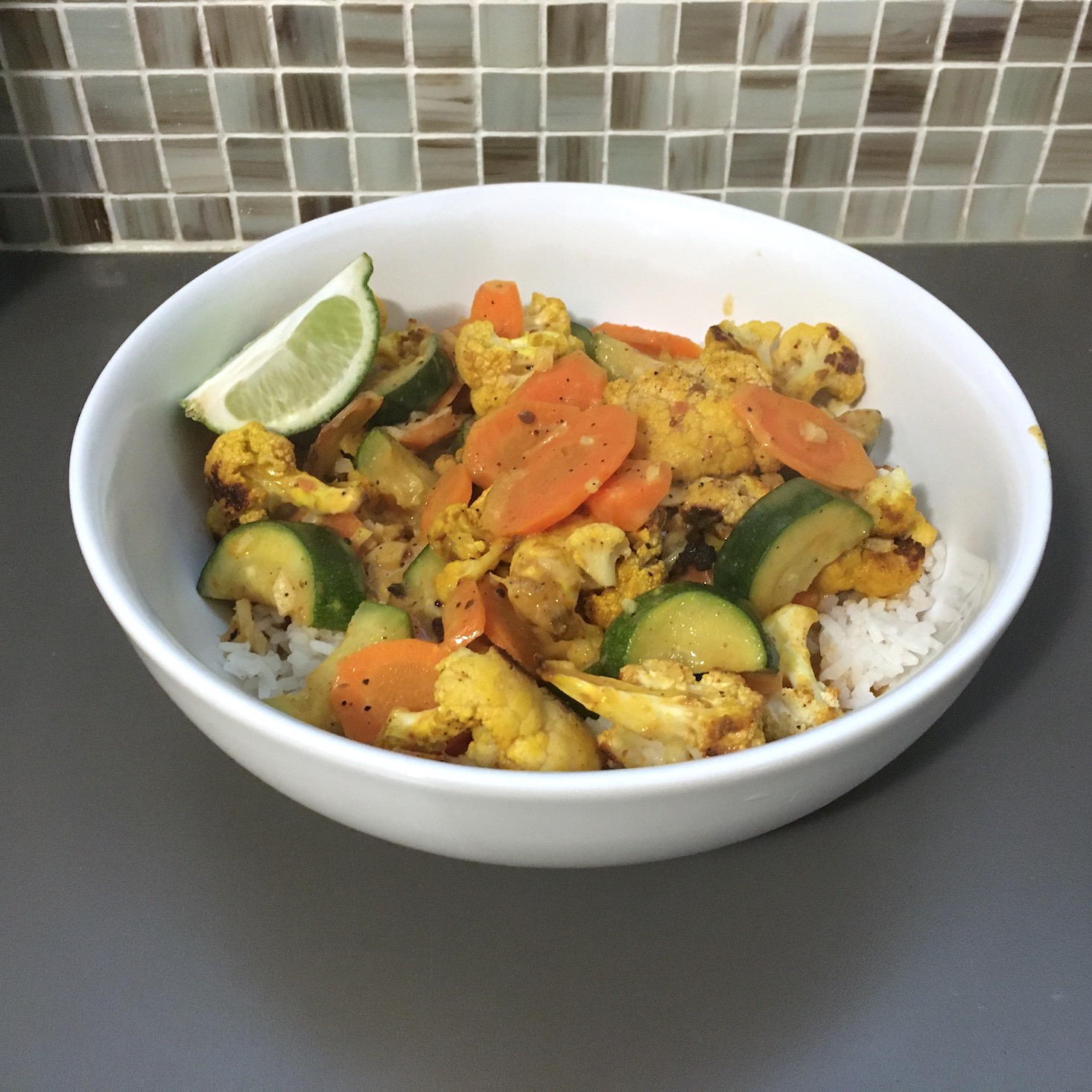 veggie curry finished dish with tile backdrop