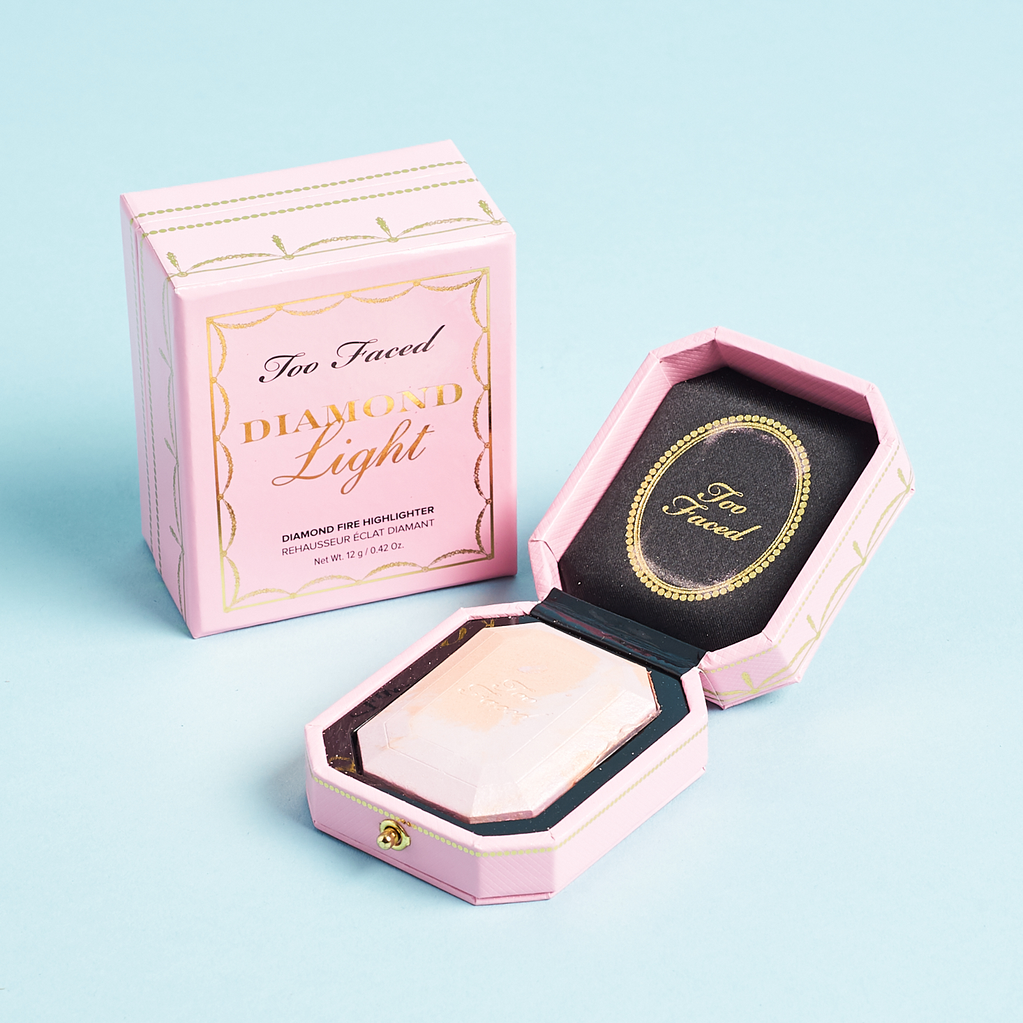 pink ring box design compact with diamind shaped powder pan inside