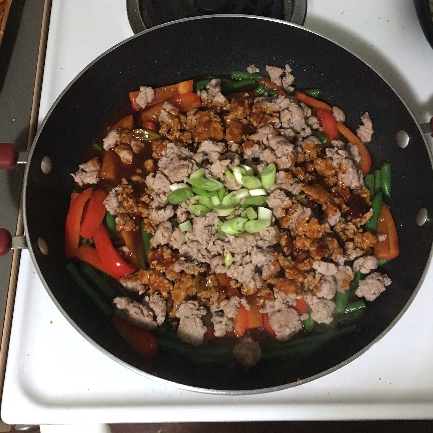 korean pork noodles all ingredients added to pan