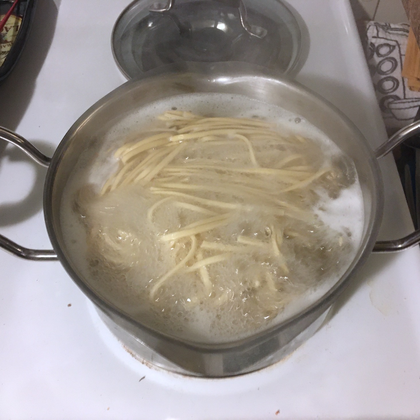 korean pork noodles pasta boiling in pot