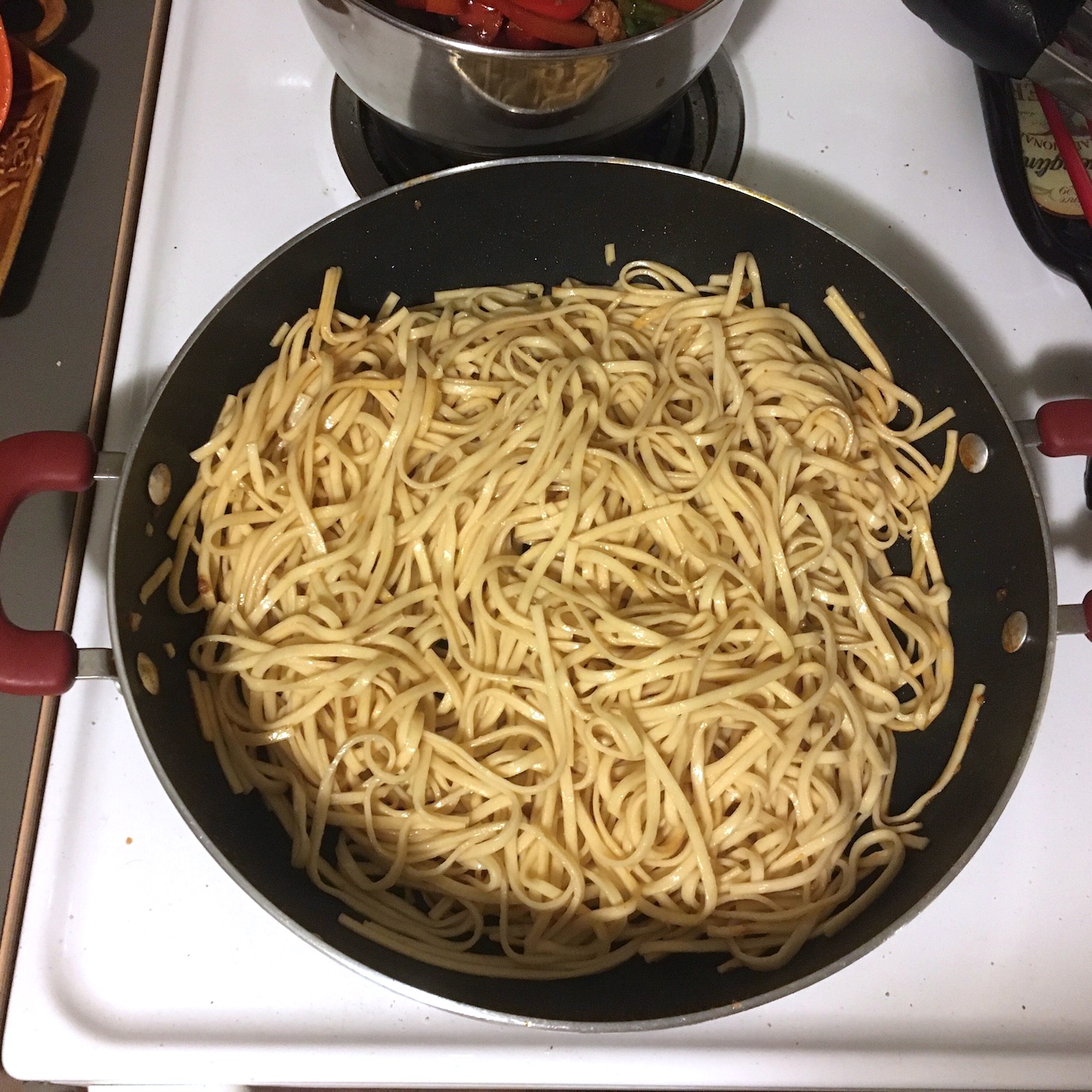 korean pork noodles pasta heating through in pan