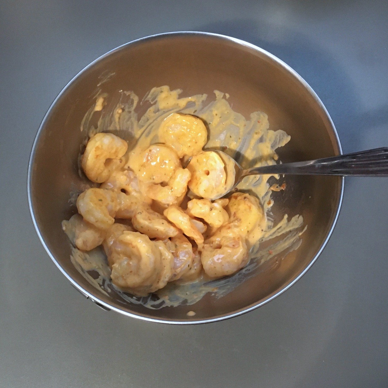 shrimp sandwich shrimp tossed in remoulade sauce inside of mixing bowl