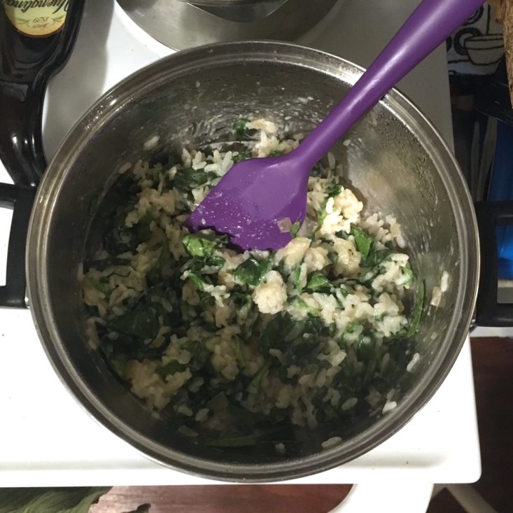 steak risotto rice mixed with spinach and onions