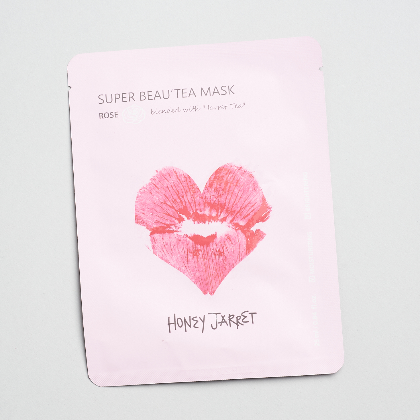 pink sheet mask with lip kiss