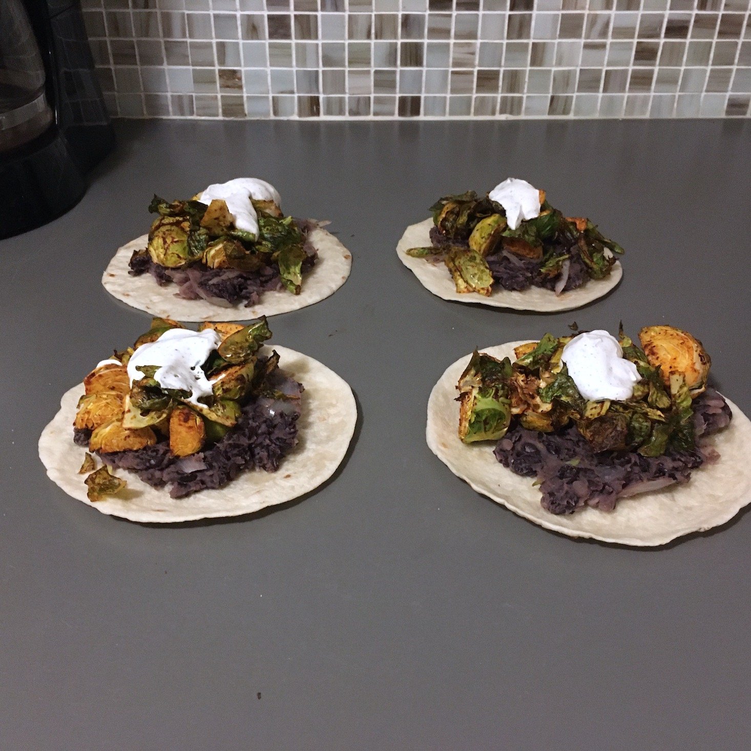 Blue Apron February 2020 - veggie tacos built tacos on a work surface front view