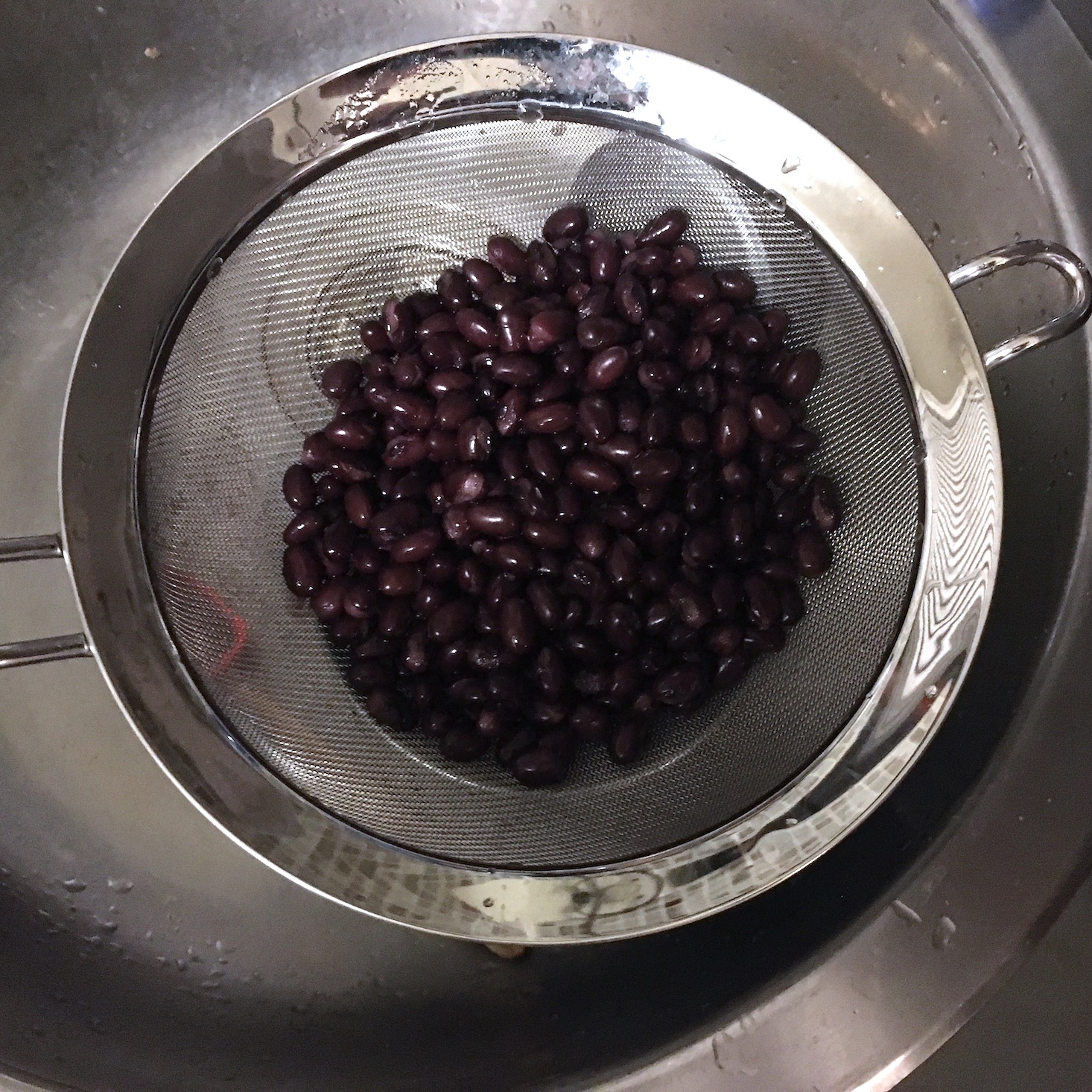 Blue Apron February 2020 - veggie tacos drained black beans in a strainer