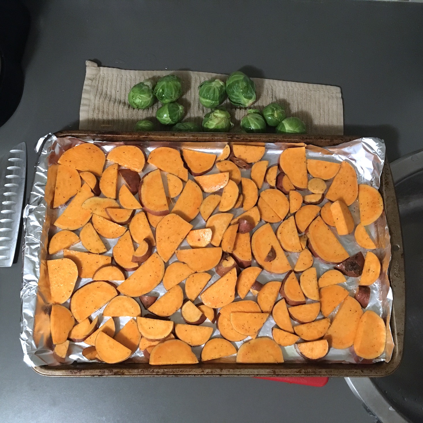Blue Apron February 2020 - veggie tacos sliced sweet potatoes prepped on a baking sheet