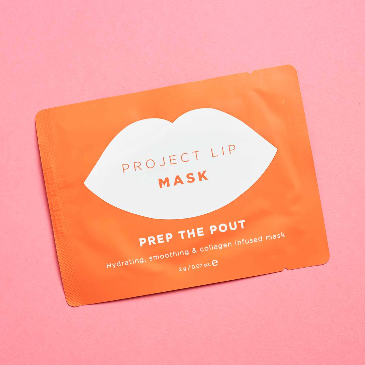 orange and white packaging with lip mask inside
