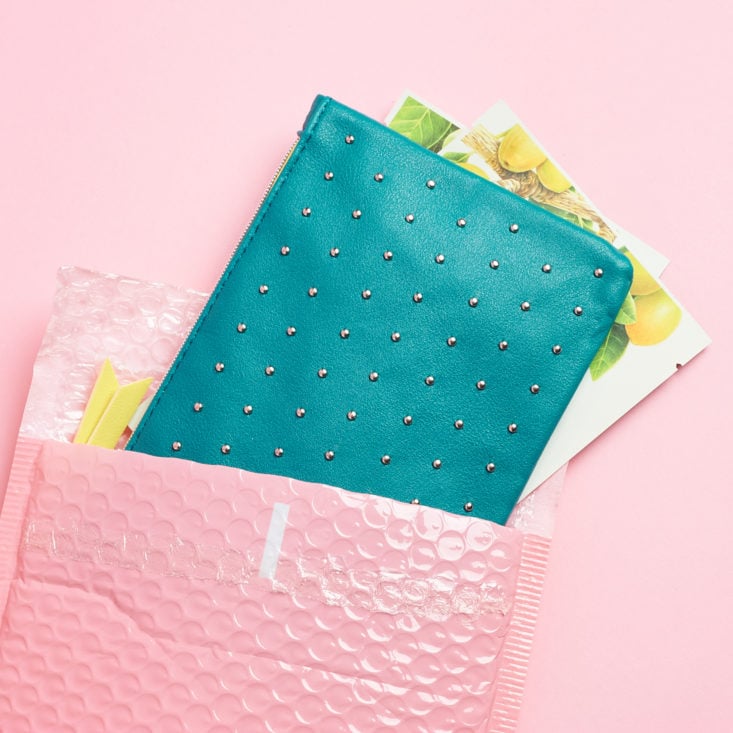 open pink envelope with teal 