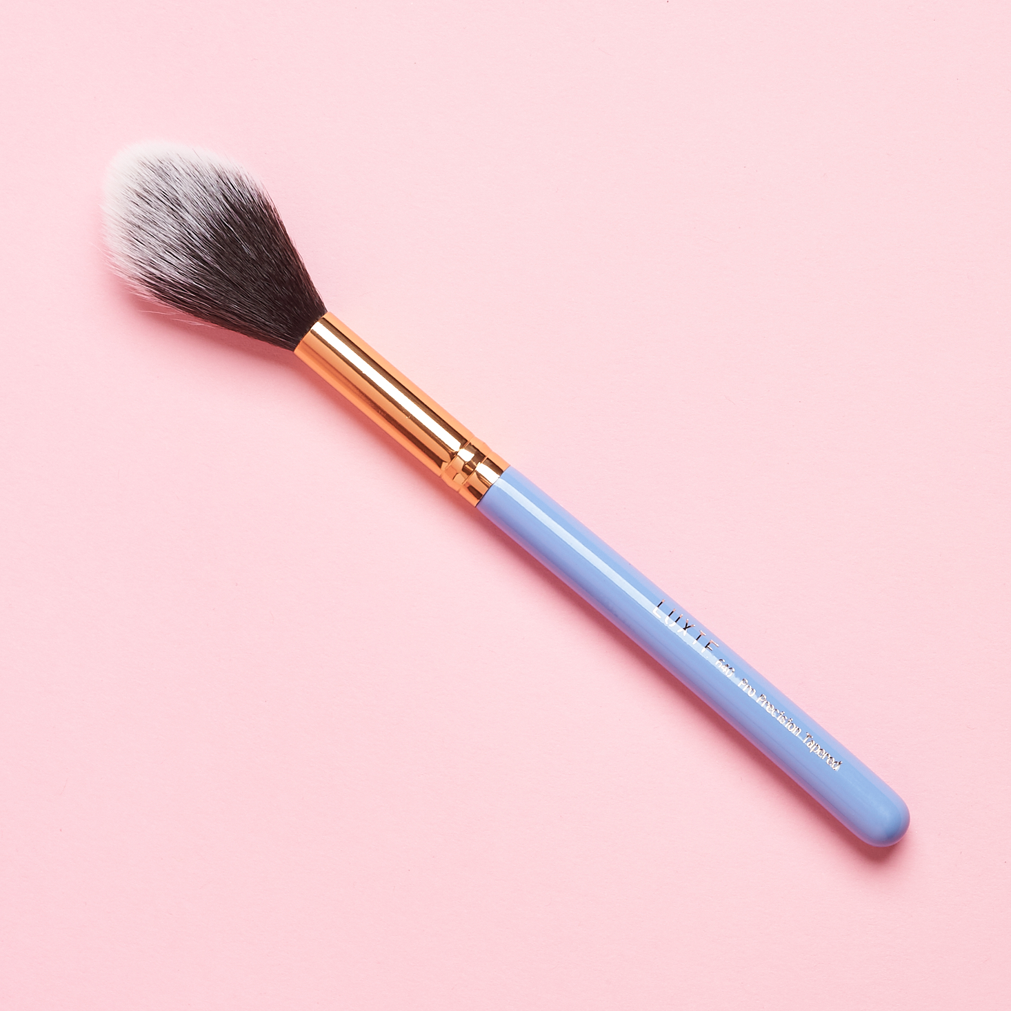 fluffy brush with periwinkle handle