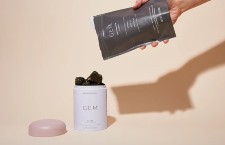 Screen shot of hand pouring bites from refill bag into canister from GEM website