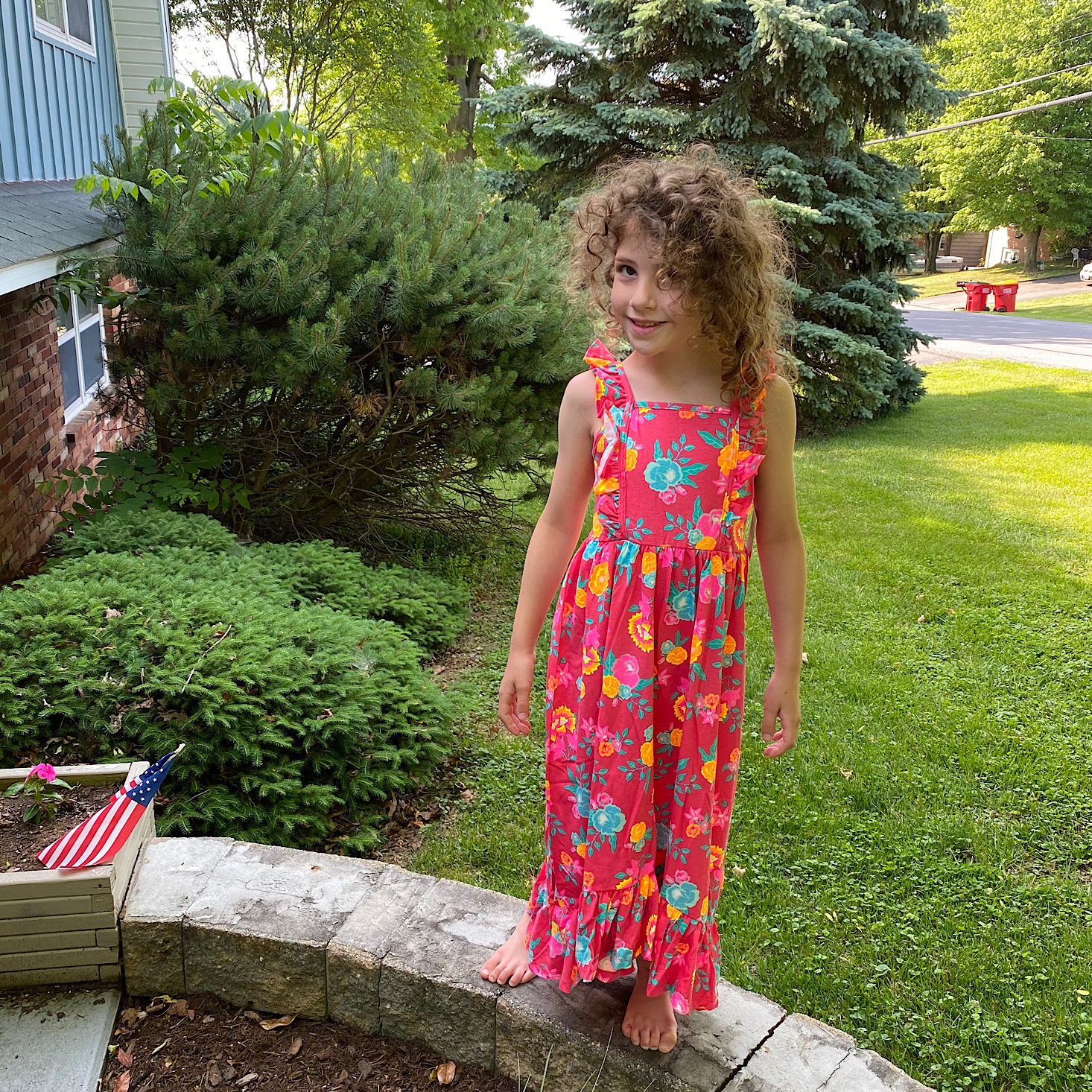 Girl in a floral dress from Fabkids.