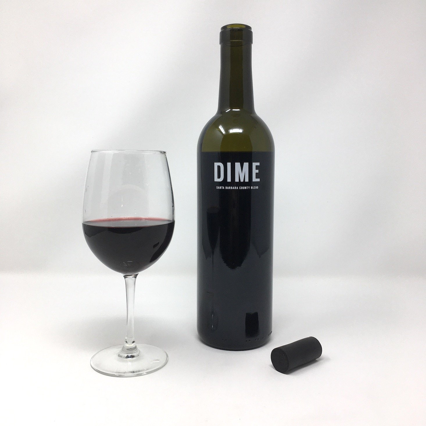 dime red blend poured glass and bottle with cork