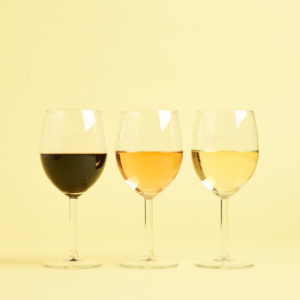 three glasses of wine showing red, rosé, and white wine received