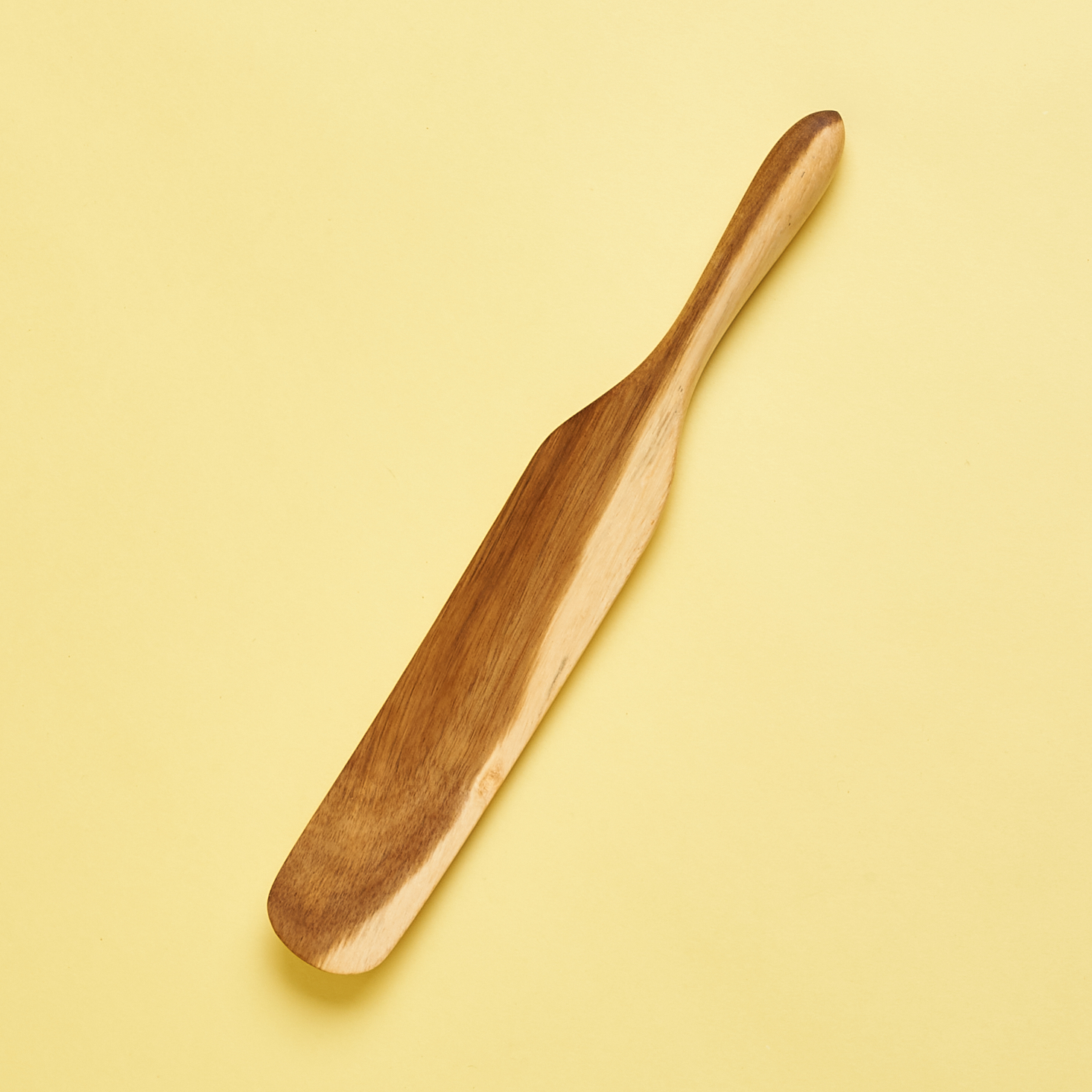 A wooden spurtle, a cross between a spatula and a spoon