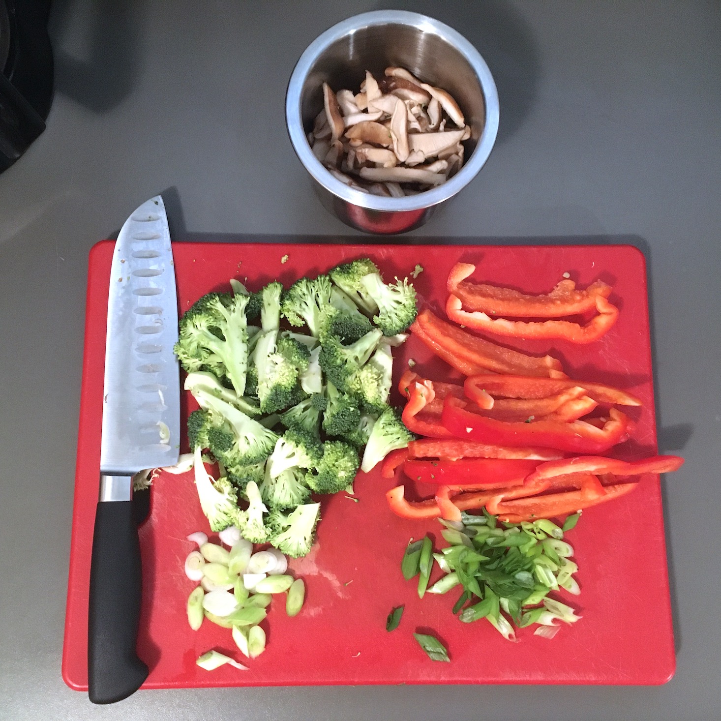 teriyaki noodle chopped vegetables on red cutting board