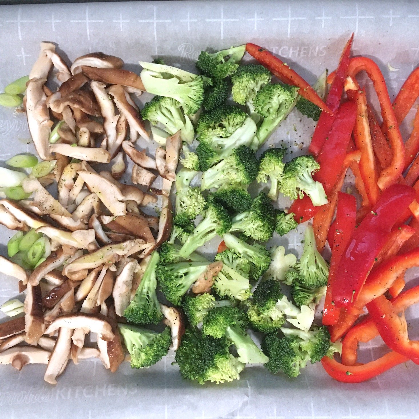 teriyaki noodles chopped ingredients oiled and seasoned on baking sheet