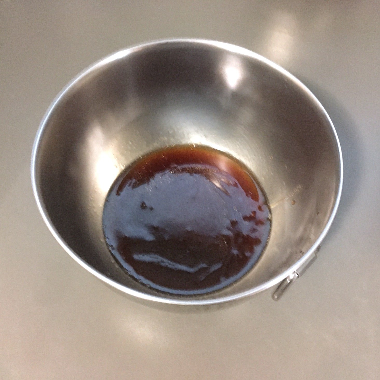 teriyaki noodles sauce mixed in small metal bowl