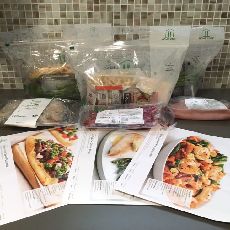 all contents with recipe bags at the back, proteins in the middle, and recipe cards in the front