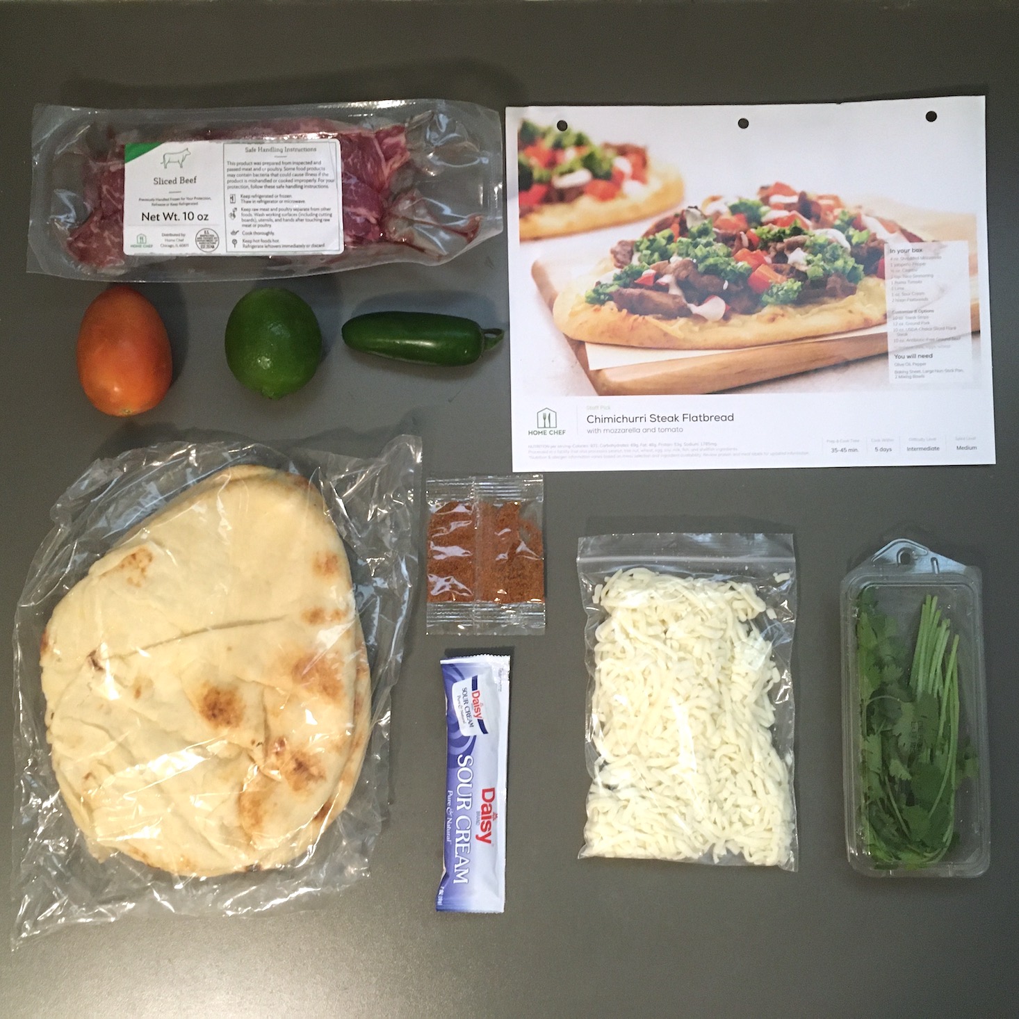 steak flatbread ingredients laid out with recipe card