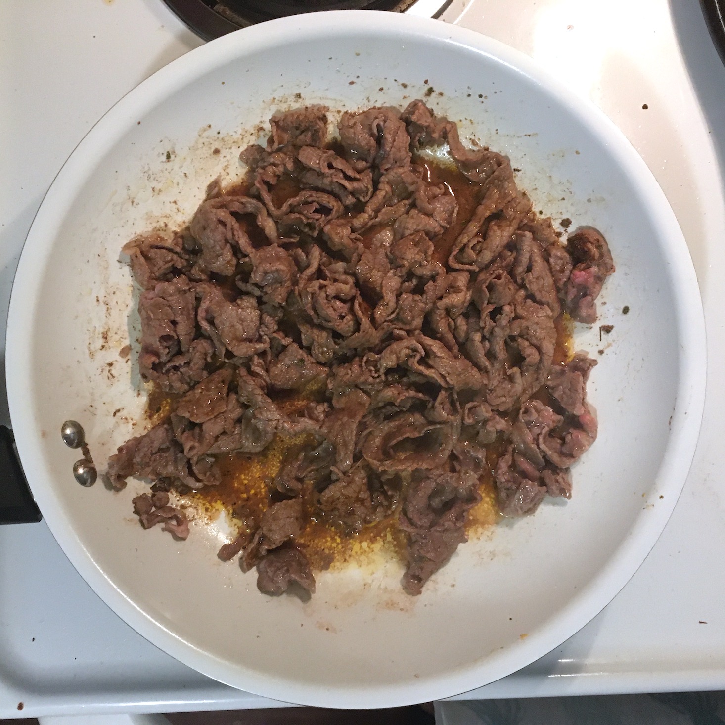 steak flatbread steak strips cooking in pan