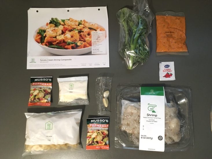 tomato shrimp pasta ingredients laid out with recipe card