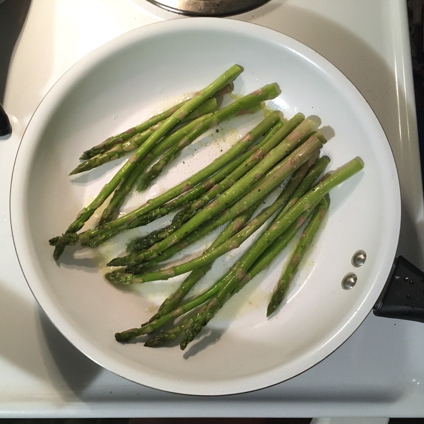 truffle butter chicken asparagus cooking in pan