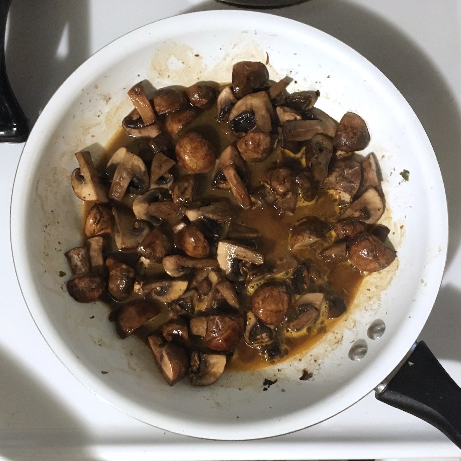 truffle butter chicken mushrooms cooking in demi-glace