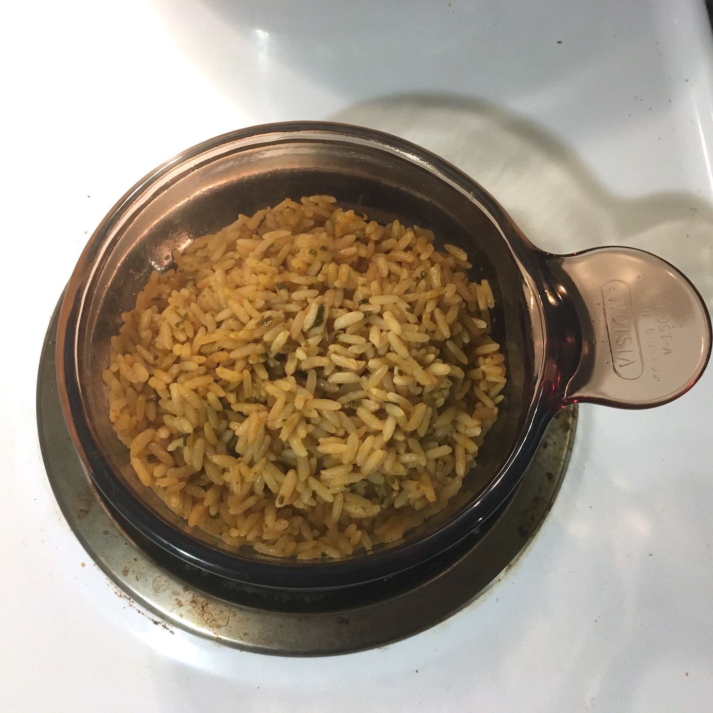 pork bowl seasoned rice reheated in glass bowl