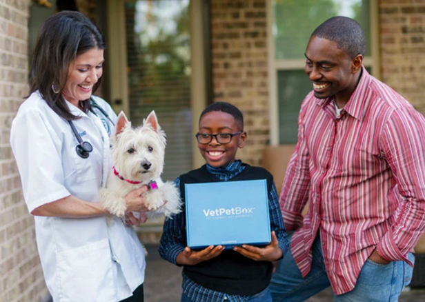 Father and son outside the vet's office with their dog and the VetPetBox.