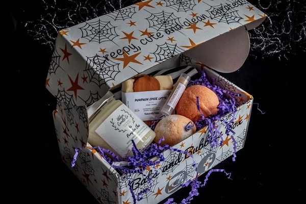 Bats & Bubbles box open to show handmade bath and body products.