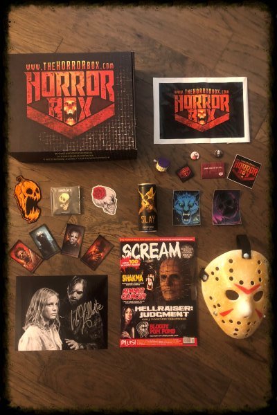 The Horror Box subscription unpacked to show all contents.