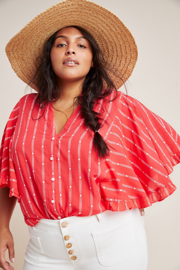Plus-size woman in nuuly rental clothes.