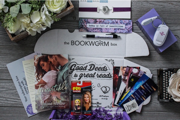 the bookworm box with books and pen