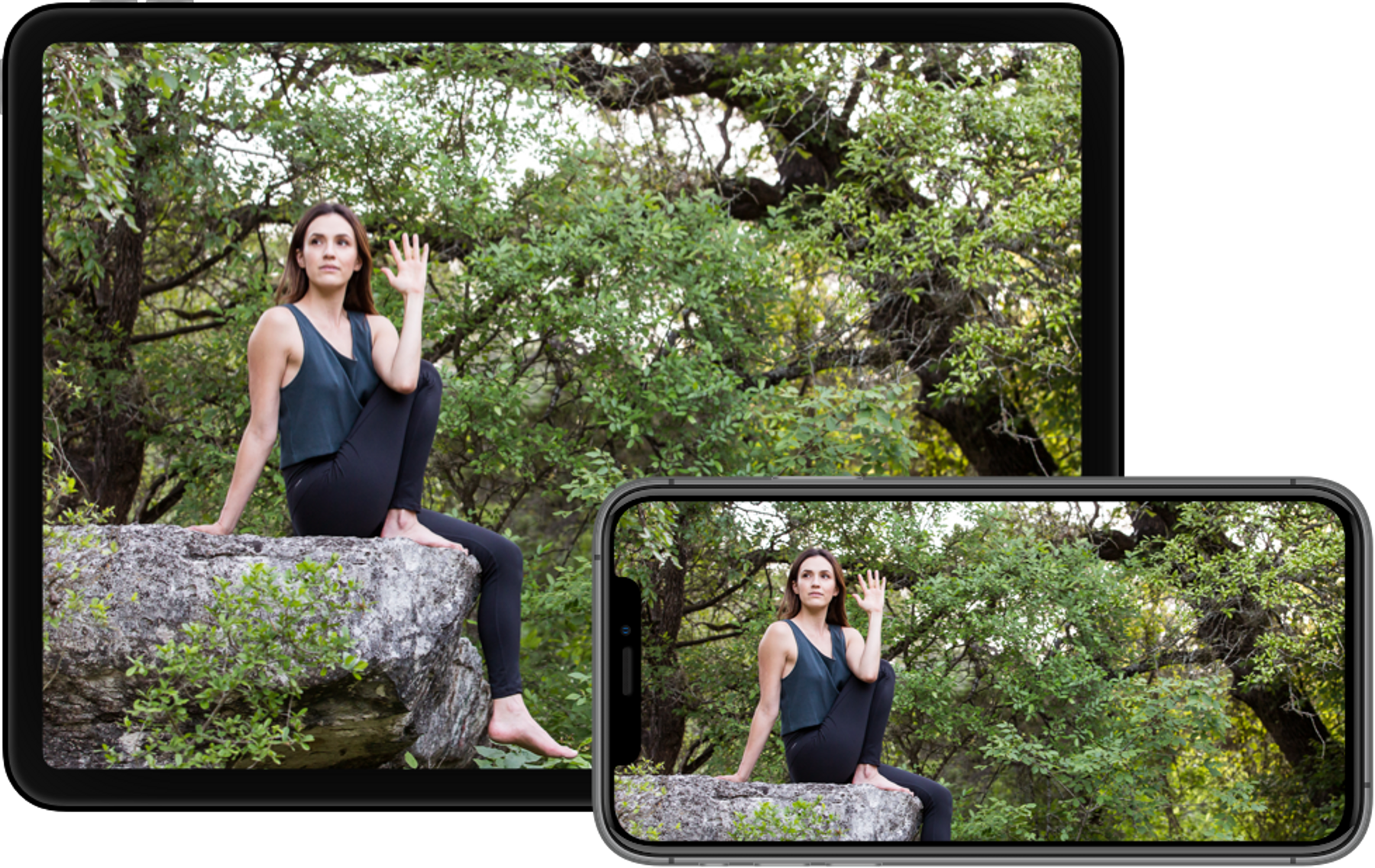 yoga instructor does pose on a rock in nature