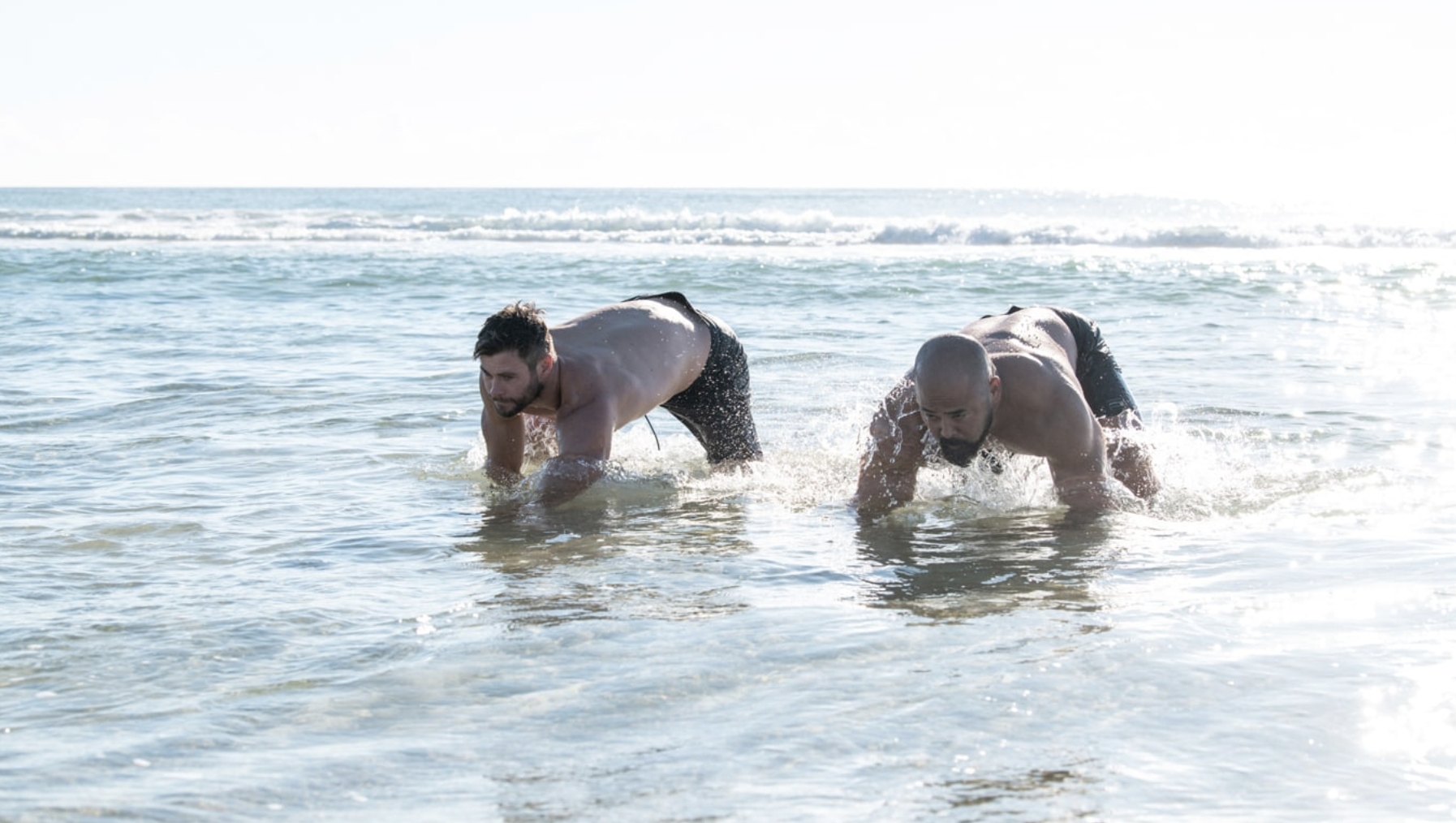 Chris Hemsworth working out in the ocean