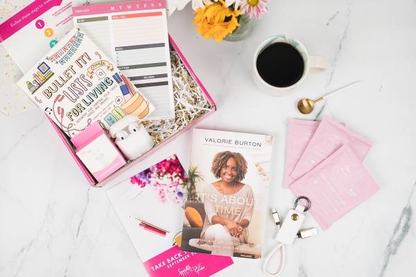 sparkle hustle grow box with book candle mug flowers